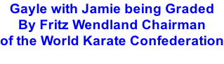 Gayle with Jamie being Graded By Fritz Wendland Chairman  of the World Karate Confederation